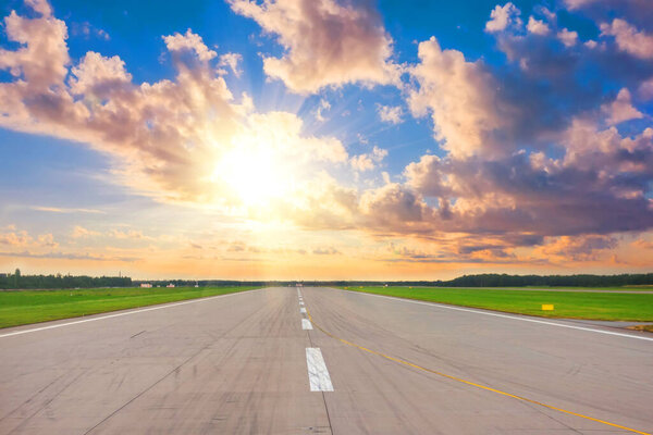 Wide runway view of the sun in the sky above the beautiful horizon, concept, future success beginnings