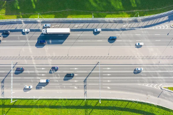 Cars driving on urban traffic road markup, aerial top view