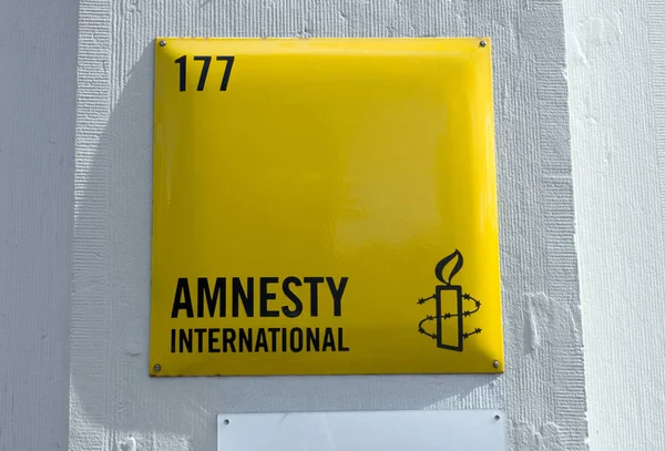 Tecken på Amnesty International i Amsterdam Stockbild