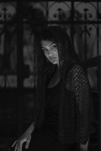 photo of young gorgeous woman with scarf in church