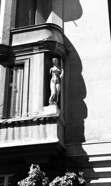 Old building with female sculpture, Serbia, closeup