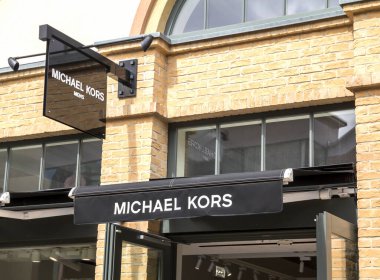 Ingolstadt, Germany : View at Michael Kors shop in Milan. Michael Kors is a New York City-based fashion designer widely known for designing classic American sportswear for women. clipart