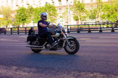 Motorcyclist rides at high speed on the highway The photo was taken on the Prospekt Mira metro station in Moscow, spring 2019, Moscow, motorbike, Avenue, car.  clipart