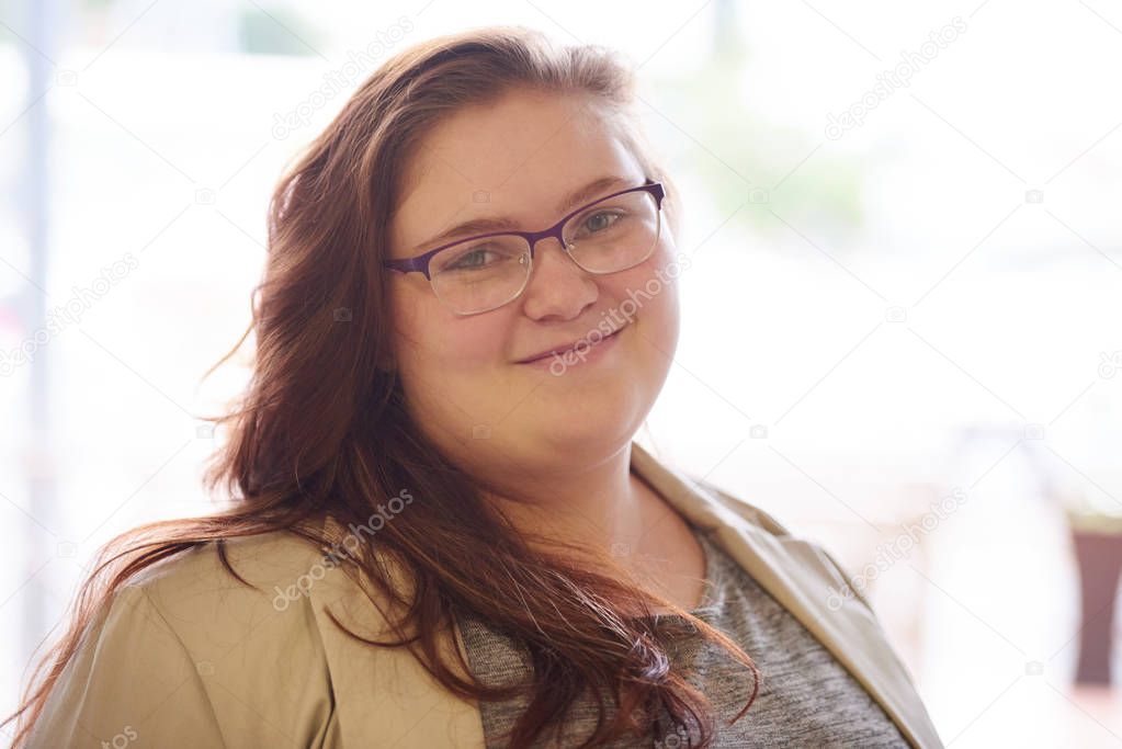 close up portrait of beautiful plus size young adult woman