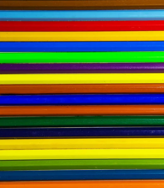 Lápis de madeira coloridos no fundo — Fotografia de Stock