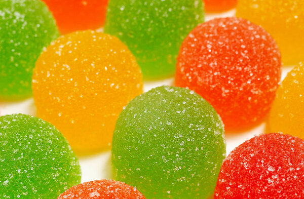 colored marmelades on white background