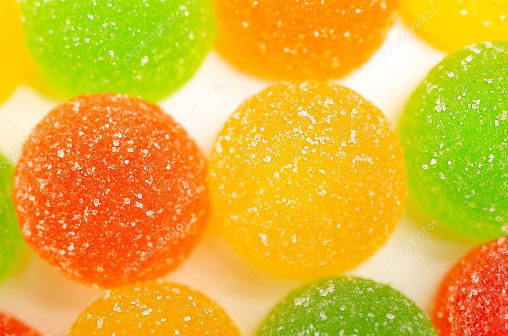 Colored marmelades on white background