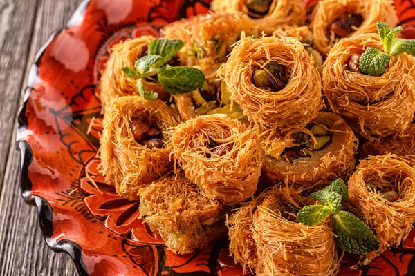 Eastern sweets on an old wooden table.