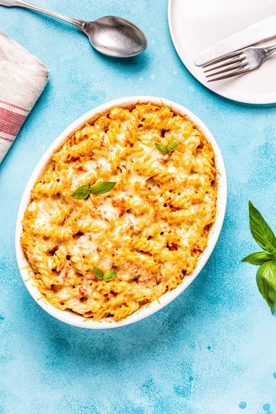 Mac and cheese, pasta baked with cheese sauce, top view.