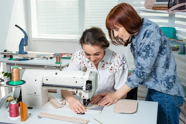 Mentor Teaches Student Sew Stock Picture