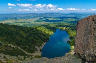Lake from the height of the mountain top clipart