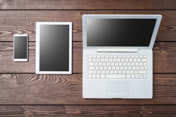 Technology background with modern white computer, tablet and smart phone