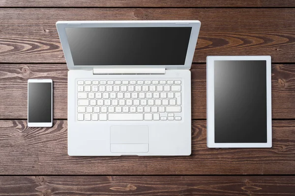 Technology background with modern white computer, tablet and smart phone