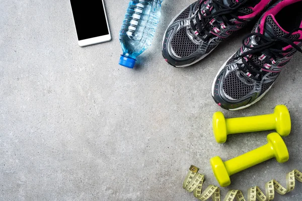 Sport accessories on gray stone background