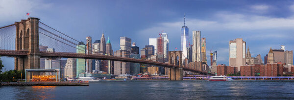 View to Manhattan skyline from Brooklyn Bridge Park Dumbo before thunderstorm.