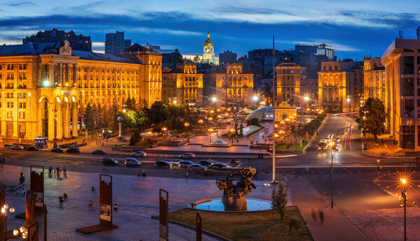 Kyiv / Ukraine - August 10 2020: Colorful sunset over Nezalezhnosti Square with Sophia Cathedral Bell Tower in the background.