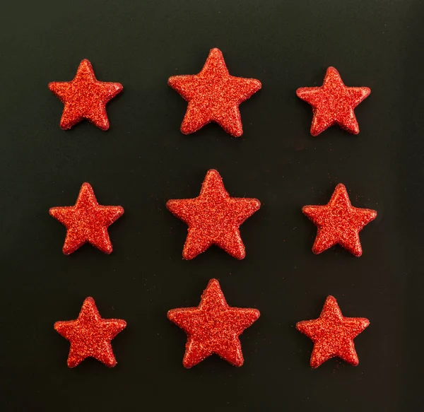 Nueve Estrellas Rojas Sobre Fondo Negro Acostado Vista Desde Arriba Imágenes De Stock Sin Royalties Gratis