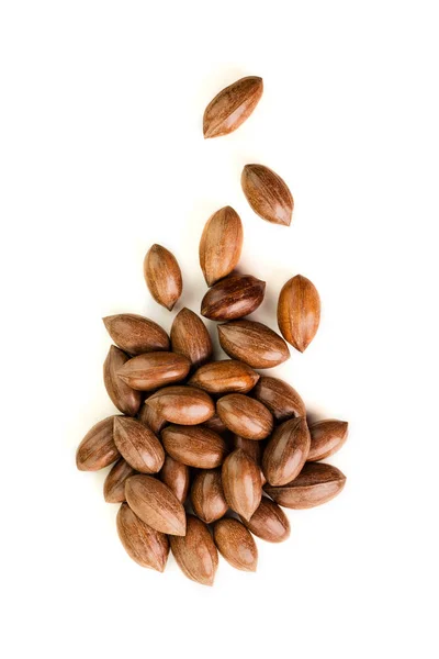 Not cleaned pecan nuts in the shell isolated on white. — Stock Photo, Image