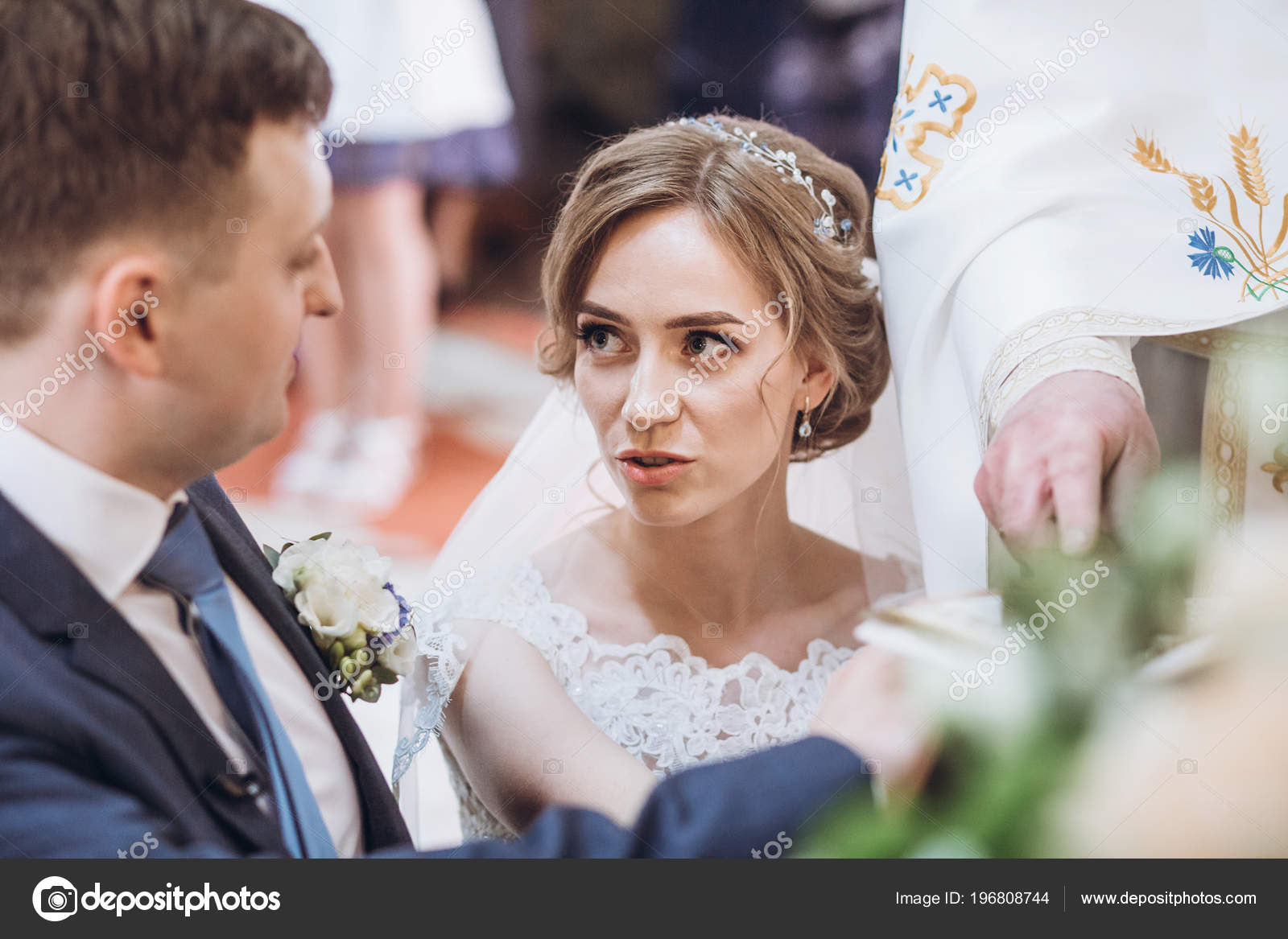 exchanging wedding vows bride groom putting hands bible saying