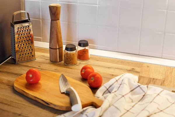 Wooden Board Knife Tomatoes Olive Oil Spices Glass Jar Pepper — Stock Photo, Image