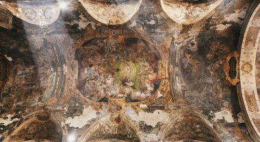 amazing old ceiling in church or cathedral with sunlight. ancient walls with old paintings, barokko fresco clipart