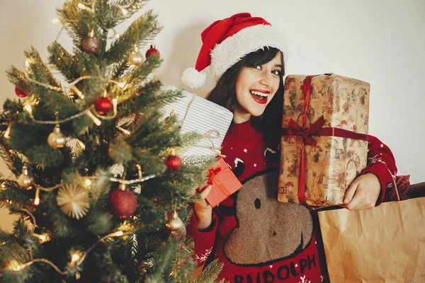 Merry Christmas Happy Girl Santa Hat Holding Many Gift Boxes — Stock Photo, Image