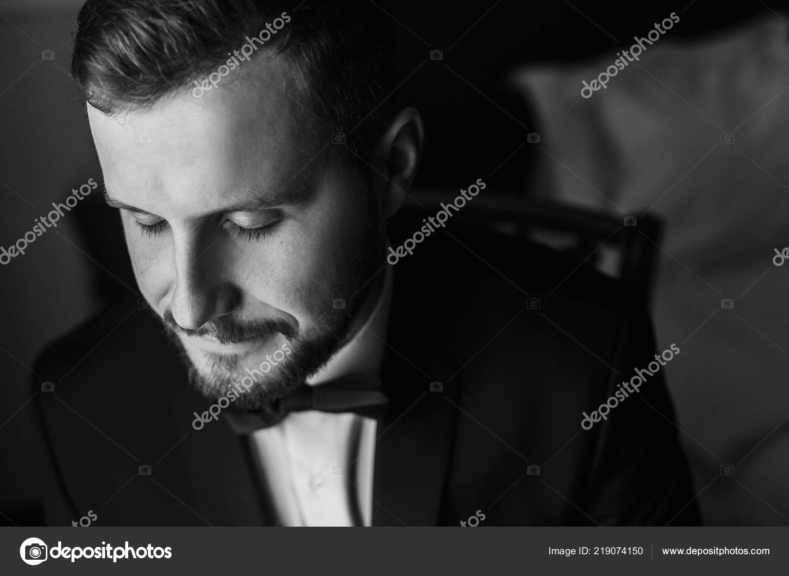 Stylish Groom Black Suit Bow Tie Sitting Chair Window Light