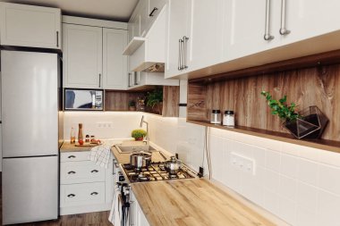 Lüks modern mutfak mobilya gri renk ve çelik fırın, buzdolabı, lavabo, ahşap masa, tencere. İskandinav tarzı gri dolaplarında. Ev yenileme. Şık mutfak dekorasyon.