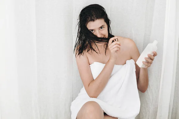 Young Happy Woman White Towel Holding Conditioner Hair Smiling Bathroom — Stock Photo, Image