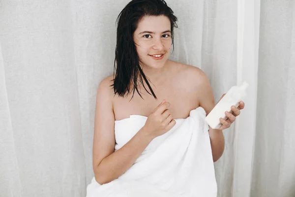 Young Happy Woman White Towel Holding Conditioner Hair Smiling Bathroom — Stock Photo, Image