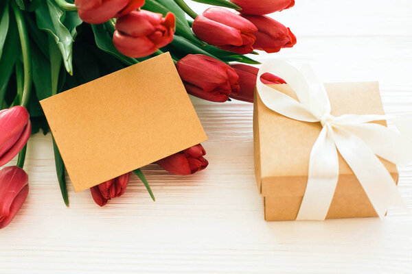 Happy Mothers day. Beautiful red tulips with gift box and craft 