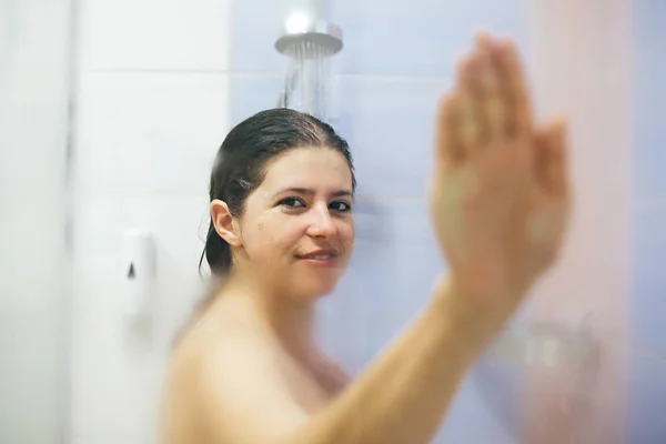 Young happy woman taking hot shower at home or hotel bathroom. B — 스톡 사진