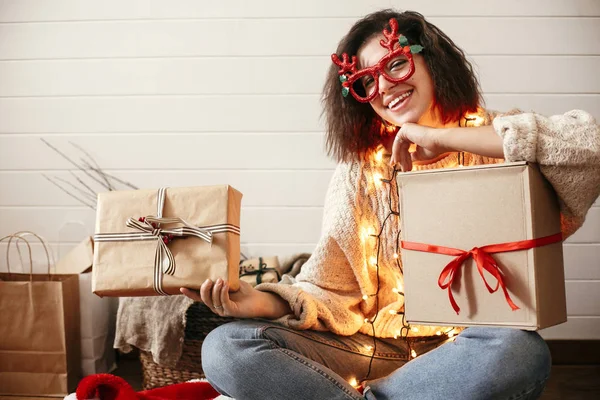 Stylish happy girl in festive glasses with reindeer horns smilin — Stock Photo, Image