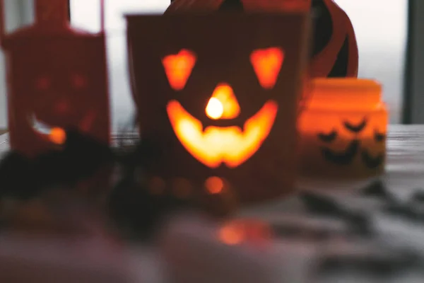 Blurred image of glowing jack o lantern face, festive candy, sku — Stock Photo, Image