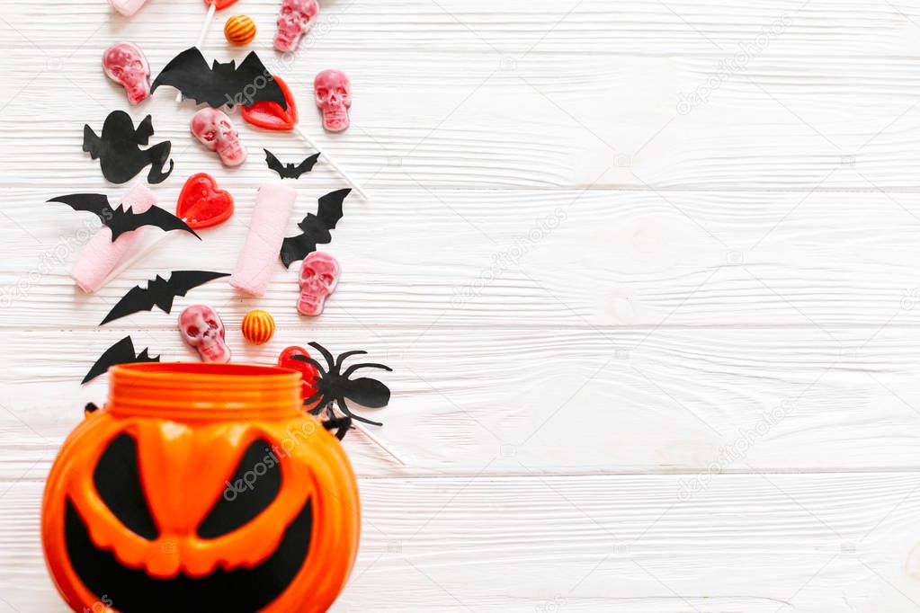 Halloween candy with skulls, black bats, ghost, spider decoratio
