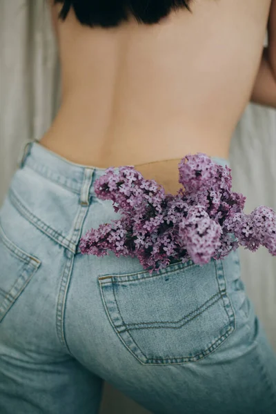 Blooming Lilac Flowers Denim Jeans Pocket Rustic Background Woman Posing — Stock Photo, Image