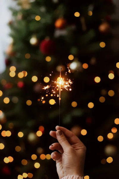 Happy New Year Burning Sparkler Hand Background Golden Bokeh Lights — Stock Photo, Image