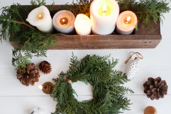 Rustic Christmas Wreath Candles Pine Cones Ornaments White Wooden Table — Stock Photo, Image