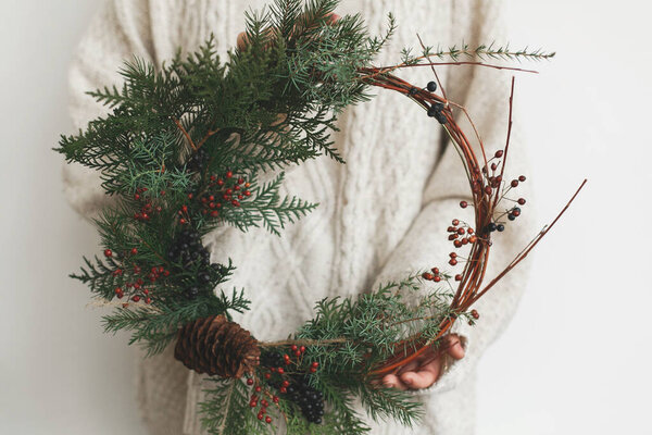 Woman Stylish Knitted Sweater Holding Modern Christmas Wreath White Background — Stock Photo, Image