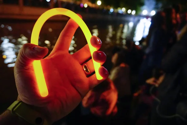 Glow stick in man hand