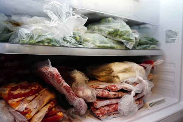 Frozen meat and vegetables in the deep freeze
