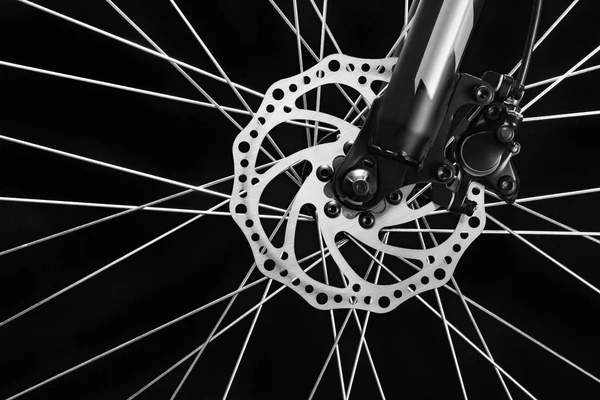 Mountain bicycle photography in studio. Bike wheel with disc brakes. Bike part.