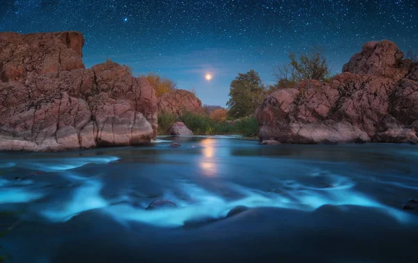 Magestic moonrise above the rocky river
