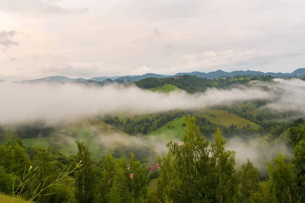 Beautiful from the nature with fog and clouds at sunset