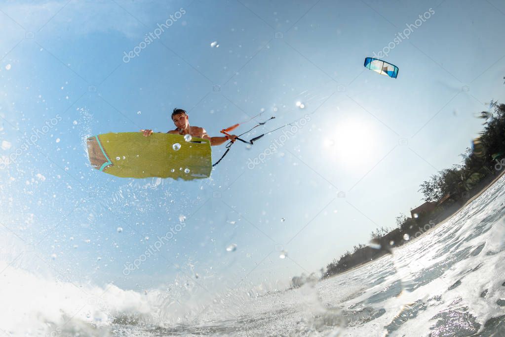 A kite surfer rides the waves