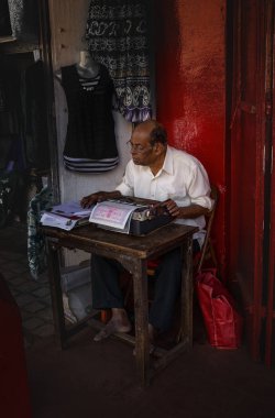 India - Nov 29, 2014. Typing service on street in Margao, South Goa, India clipart