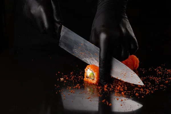 Process Cutting California Roll Sushi Red Masago Caviar Hand Black — Stock Photo, Image