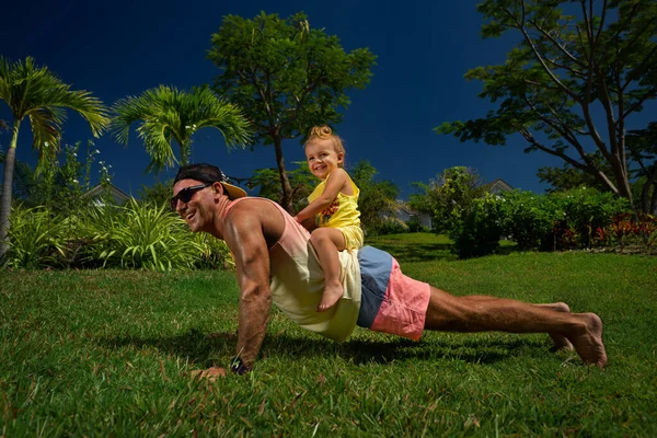 Smiling Father Doing Push Ups Little Daughter Sitting His Back — Stock Photo, Image