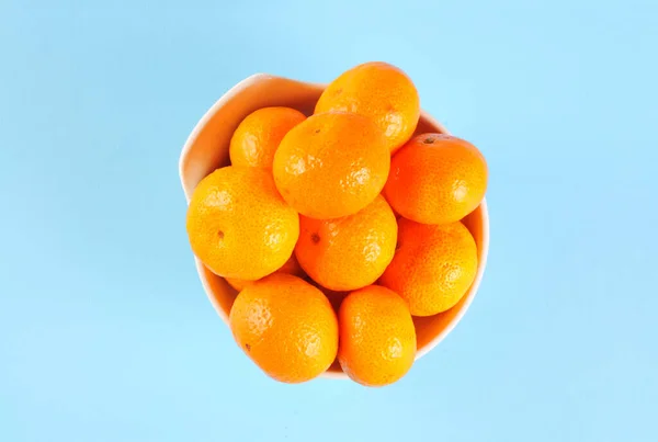 Top view of small orange. Mandarin orange. Tangerines orange with leaf.