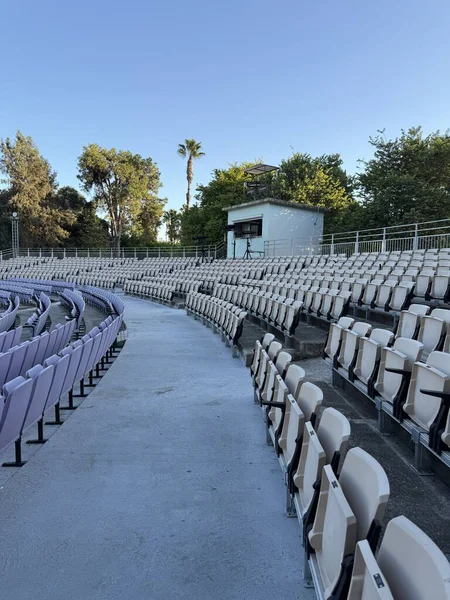 An open-air theater with seats for spectators. An empty theater without spectators.